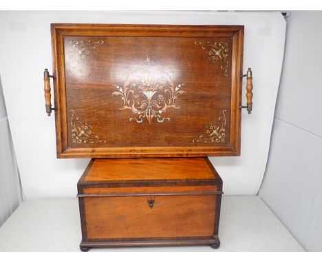 A 19th Century satinwood Tea Caddy with rosewood banding, the hinged lid enclosing two lidded boxes and a glass bowl, 13in, a