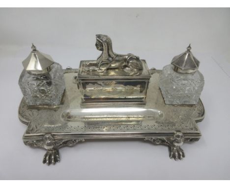 A Victorian silver Inkstand of shaped rectangular form fitted pair of silver lidded cut glass Inkwells flanking lidded box wi