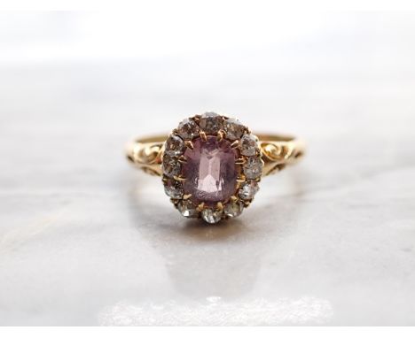 A Victorian Pink Spinel and Diamond Cluster Ring claw-set oval-cut spinel within a frame of old-cut diamonds in 18ct gold, ri