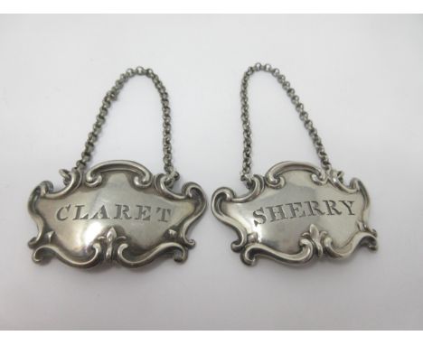 A pair of Victorian silver escutcheon Labels, Sherry and Claret, London 1842, maker: Edward and John Barnard 