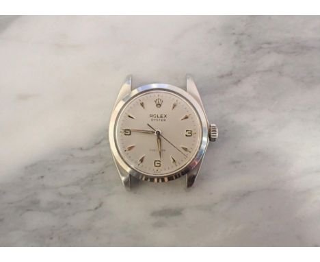A vintage Rolex Oyster Precision Wristwatch the silvered dial with arabic numerals at 3, 6 and 9, the remainder arrowhead mar