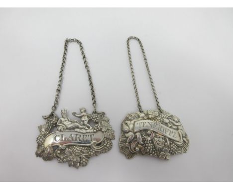 Two early 19th Century Irish silver Labels, Claret and Teneriffe with fruiting vine and cherub embossing, Claret by Henry Fla