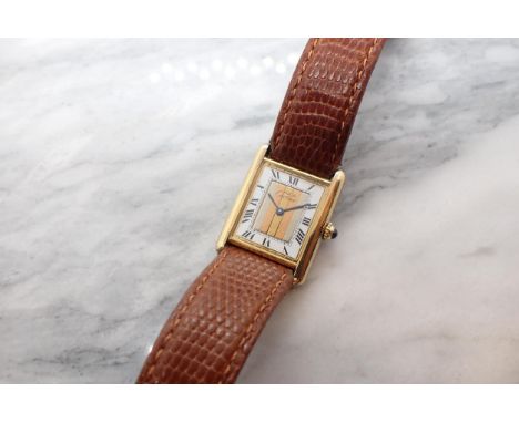 A lady's Must De Cartier Tank quartz Wristwatch the rectangular dial with roman numerals, central tri-colour panel, blue cabo