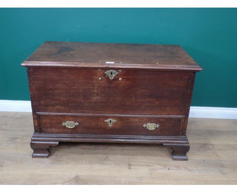 An 18th Century mahogany Mule Chest with brass studded hinged lid above lower drawer mounted on shaped ogee bracket feet (one