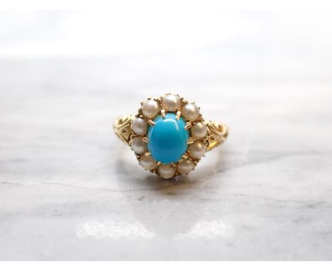 A late 19th Century Turquoise and Seed Pearl Cluster Ring claw-set oval turquoise cabochon within frame of pearls, ring size 