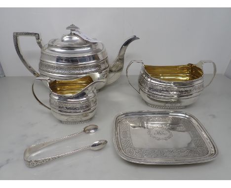 A George III silver five piece Tea Service of boat shape with floral engraved frieze, initials within laurel cartouche, Edinb