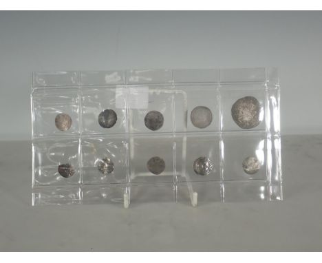Ten hammered silver Coins, of Elizabeth I, James II, Charles I to include an Elizabeth Shilling and sixpences dated 1570 and 
