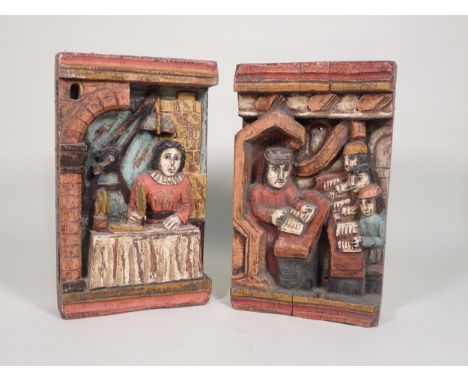 A pair of Folk Art Carvings depicting a figure preaching to others, and the other depicting a scribe writing with a quill pen