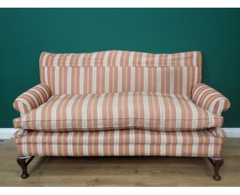 A Georgian style camel back Sofa with red and gold striped upholstery mounted upon walnut cabriole front supports and pad fee