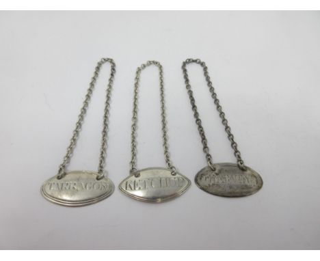 A George III small silver oval Label, Tarragon, London 1791, maker: Susanna Barker, another Ketchup by Barker, and another Ha