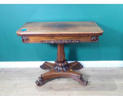 A William IV rosewood fold-over Card Table on baluster turned column and platform base and scroll feet 2ft 11in W x 2ft 5in H