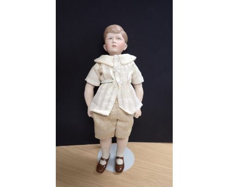 A Prince Charles bisque headed Doll by Martha Thompson USA, 11in 