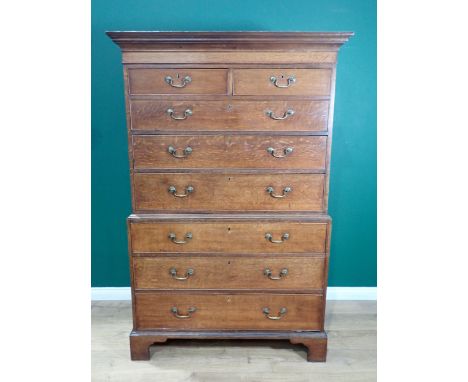 A Georgian oak Chest on Chest, having moulded cornice over plain frieze, the upper half fitted two short and three long cock 