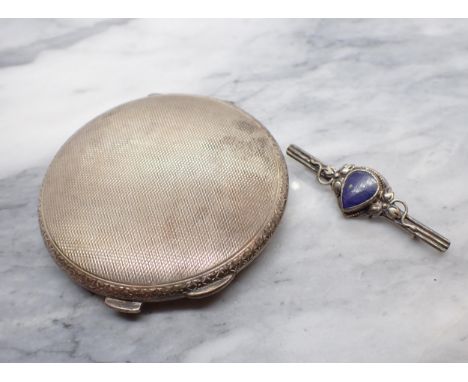 A circular silver Compact with engine turning and a white metal Bar Brooch set lapis lazuli 