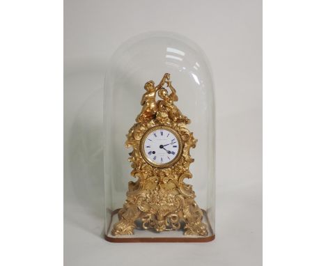 A 19th Century French gilded metal Mantel Clock by Le Roy &amp; Fils with white enamel dial surmounted by a child and putti a