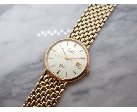 A Rotary quartz Wristwatch the textured dial with hourly baton markers, sweep seconds hand and date aperture at 3 o'clock in 
