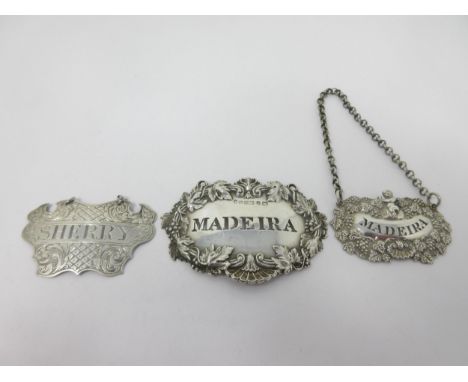 A Victorian silver escutcheon Label, Sherry, Birmingham 1846, maker: George Unite, a Madeira Label, Birmingham (?), maker: Ro