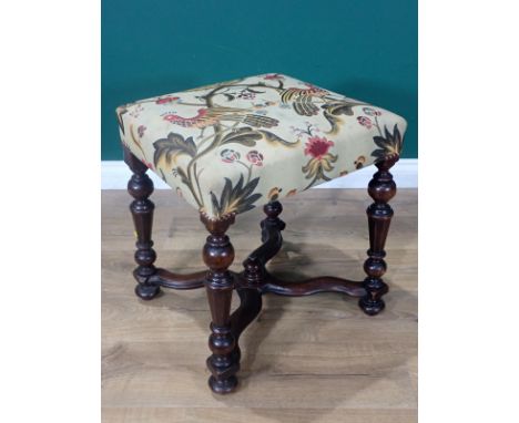 A Queen Anne style upholstered rectangular Stool with stuff over seat, raised on turned and octagonal tapered supports joined