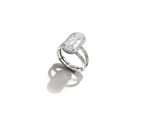 BOODLES: DIAMOND RINGThe Ashoka-cut diamond, weighing 3.07 carats, within a brilliant-cut diamond surround, the gallery and b