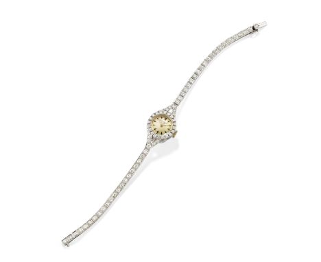 PATEK PHILIPPE: DIAMOND WATCHThe circular dial with Arabic and baton numerals, within a brilliant-cut diamond-set bezel, to a