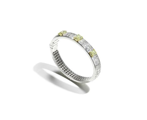 GRAFF: DIAMOND AND COLOURED DIAMOND BANGLESet throughout with step-cut diamonds in concealed settings, the front highlighted 