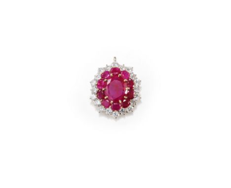 RUBY AND DIAMOND PENDANTThe oval-cut ruby, weighing 8.10 carats, within a surround of similarly-cut rubies and brilliant-cut 