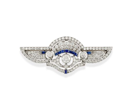 ART DECO SAPPHIRE AND DIAMOND BROOCH, CIRCA 1920Of openwork design with wing motif terminals, set with a principal brilliant-