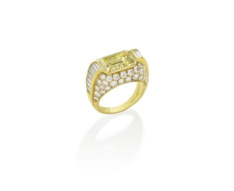 BULGARI: COLOURED DIAMOND AND DIAMOND 'TROMBINO' RINGThe step-cut Fancy Yellow diamond, weighing 4.80 carats, between graduat