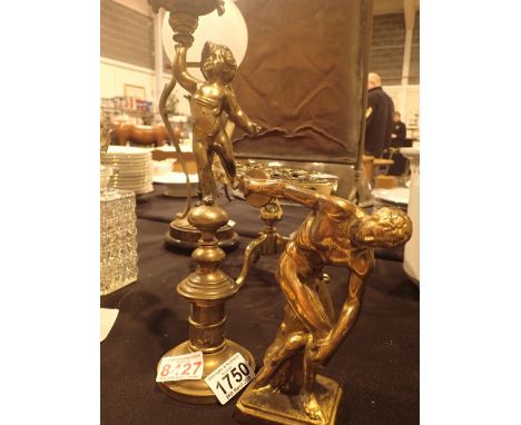 Brass single candlestick H: 31 cm with cherub figurine and brass discus figurine