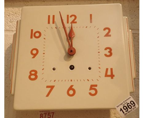 Enamel wall clock with key and pendulum