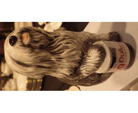 Royal Doulton Dulux dog H: 15 cm CONDITION REPORT: Appears to be first quality with no apparent damage or restoration.