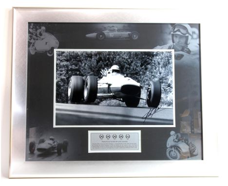 Black and white F1 photograph, signed by Jackie Stewart, framed and glazed, bearing certificate of authenticity to the revers