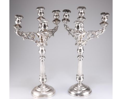 A PAIR OF 19TH CENTURY CONTINENTAL SILVER FOUR-LIGHT CANDELABRA, each with scrolling foliate-form branches and fluted taperin