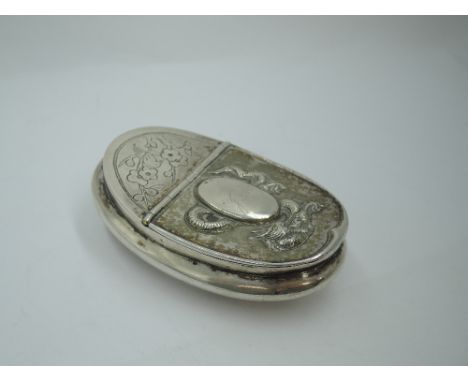 An early 20th Century Chinese silver snuff box of curved oval form having engraved dragon to base and repousse dragon decorat