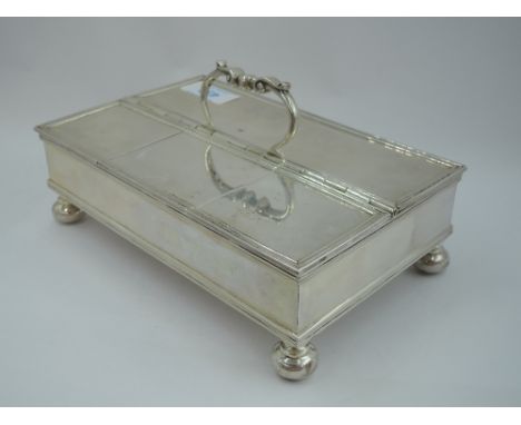 An Edwardian Scottish silver ink stand of plain rectangular form having reeded rims, swing handle and bun feet, the case has 