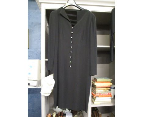 A Guy Laroche ladies black formal dress with jewelled buttons to the front and ladder straps to the back in 100% rayon, appro