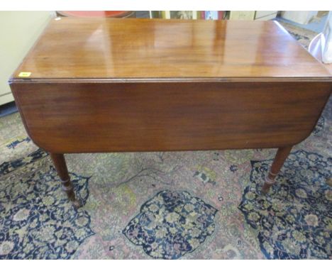 A Victorian mahogany Pembroke table with single drawer on turned legs and ceramic castors, 28 1/2 x 41 6/8 x 22