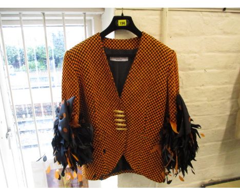 Circa 1970 - a Christian Dior Boutique ladies jacket in orange and black herringbone design with black and orange feather cuf