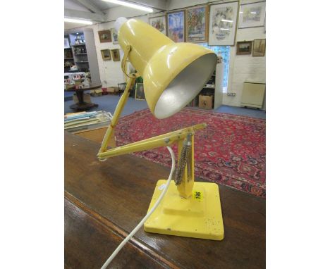 An early 20th century yellow painted metal Herbert Terry, anglepoise desk lamp