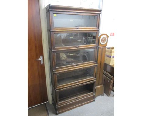 A Globe Wernicke five-section stained satinwood bookcase on a plinth, 73h x 34w