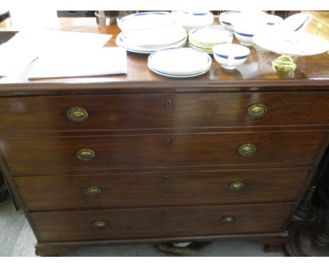 An early 19th century string inlaid mahogany three-drawer dressing chest with a facsimile drawer, raised on ogee bracket feet