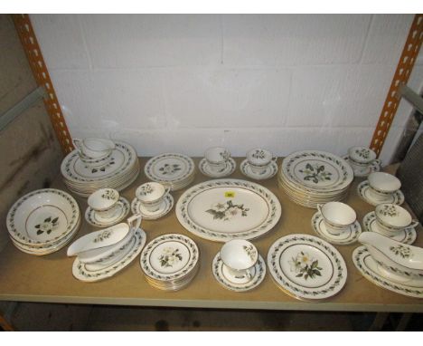 A Royal Worcester Bernina dinner and tea service decorated with a central flower sprig and a continuous leaf and flower head 