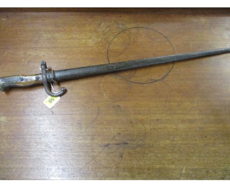 A 19th century French Gros bayonet in a metal scabbard, engraved and dated 1876 to blade edge