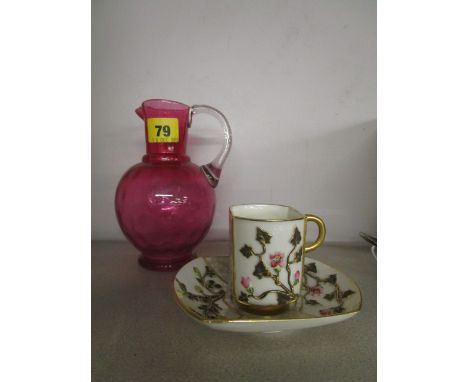 A Victorian coins dot pattern cranberry glass jug, 6 3/8 high and a Victorian Royal Worcester cabinet cup and saucer