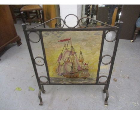 An Arts & Crafts inspired, wrought iron and tapestry fire screen, 30 h x 23 w