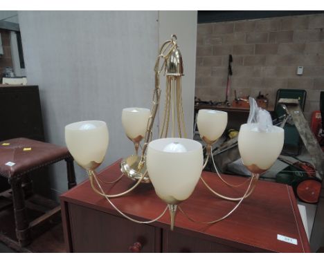 A brass effect ceiling light