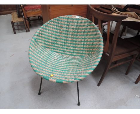 A vintage woven fibre chair of stylised designFibre in good condition, no tears or rips