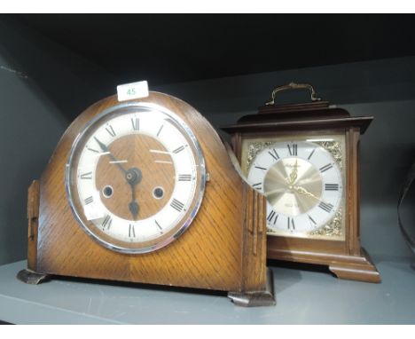 An oak bodied mantle clock by Anvil and similar bracket clock