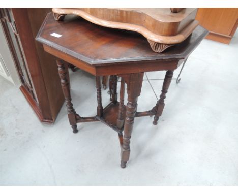 An octagonal occasional table with bobbin legs and undertier