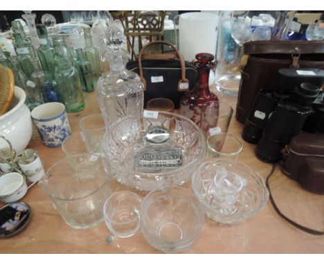 A selection of glass wares including elegant cranberry and etched wine decanter